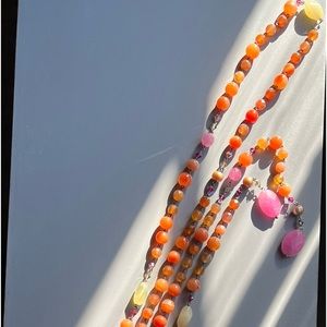 60” Coral stone with fresh water pearl and crystal accents.  Wrap necklace